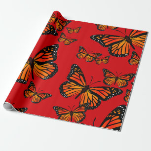 Monarch Butterflies på Red Presentpapper