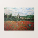 Monet fält av det röda vallmopussel pussel<br><div class="desc">Monet fält av det röda vallmopussel. Olja på kanfas från 1879. Monet målade flera olika vallmofält under hans karriär. Denna särskilda målning presenterar flera unga kvinnor i sundresses och sunhats som samlar de röda blommorna för en flod på en litet molnig sommardag. En nätt gåva för fläktar av Monet, Impressionism,...</div>