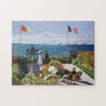 Monet Garden vid Sainte Adresse Puzzle Pussel<br><div class="desc">Monet Garden på Sainte Adresse puzzle. Olja på canvas 1867. Garden på Sainte-Adresse är en av de Fransk prästmålningarna Claude Monets mest berömd, och har ett par som står framför Sainte Adresses hamn framför Fransk flagga. Den trädgård där de står är full av blommor, segelbåtar och ångfartyg flyter i det...</div>