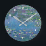 Monet Vatten Lilies Painting Rund Klocka<br><div class="desc">Oscar-Claude Monet (14 november 1840-5 december 1926) var en Fransk målare och grundare av Franskens intsionistiska stil av målning.  Uttrycket "Impressionism" härrör från titeln på en av hans målningar.   Denna målning är Vatten Lilies.</div>