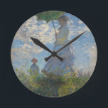 Monets kvinna med parasol rund klocka<br><div class="desc">Claude Monets mästerverk: Kvinnor med parasol.
Besök vår butik för andra matchningsobjekt</div>