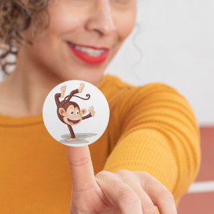 Monkey på ena handen runt klistermärke