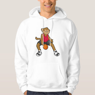 Monkey som basketspelare med basket hoodie