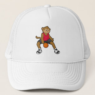 Monkey som basketspelare med basket keps