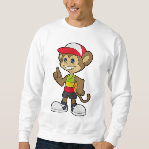 Monkey som basketspelare med basket lång ärmad tröja