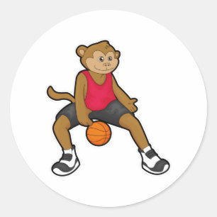 Monkey som basketspelare med basket runt klistermärke