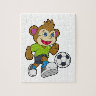 Monkey som fotbollsspelare med fotboll pussel