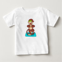 Monkey vid Yoga i stående ställning
