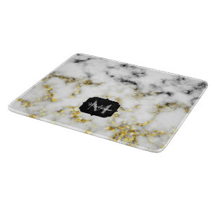 Monogram av svart och vitt marmor i gnistran guld