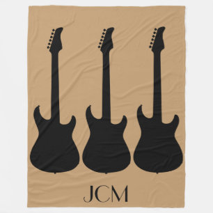 Monogram Black Electric Guitars på Camel Brown Fleecefilt