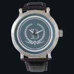 Monogram design armbandsur<br><div class="desc">Monogramdesign med dekoration av lagrets andedräkt i rund form på blå bakgrund</div>