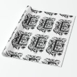 Monogram E Initial Black and White Cupid Mönster Presentpapper<br><div class="desc">Papper omslutning av Monogram E-Blommönstret i svart och vitt kan anpassas med en bild,  namn,  text,  logotyp eller foto. Byt vit bakgrund till en blå nyans,  grönt,  gult,  orange,  rosa,  röd,  brun och lila. Underbar för att stänga jul-,  födelsedag-,  babydusch- eller bröllopsgåvor.</div>
