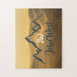 Monogram för solupphöjda bergsområden i guld pussel