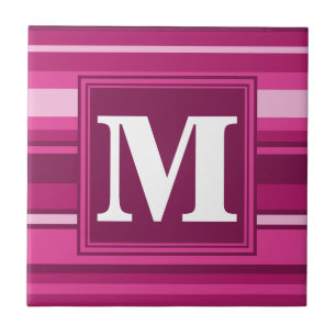 Monogram fuchsia rand kakelplatta