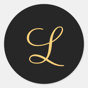 Monogram , guld färgad initial L på svart. Runt Klistermärke