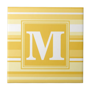 Monogram gult rand kakelplatta