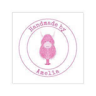 Monogram höglandskö som hanteras av självfärgande stämpel