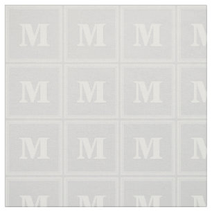 Monogram lätt grått rand tyg