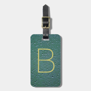 Monogram på regndroplets Struktur Bagagebricka
