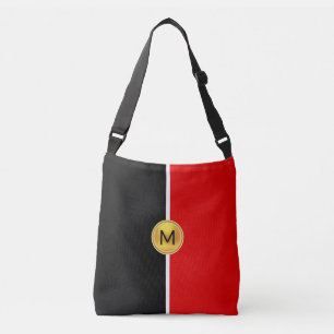 Monogram på svart och rött med vit linje axelväska