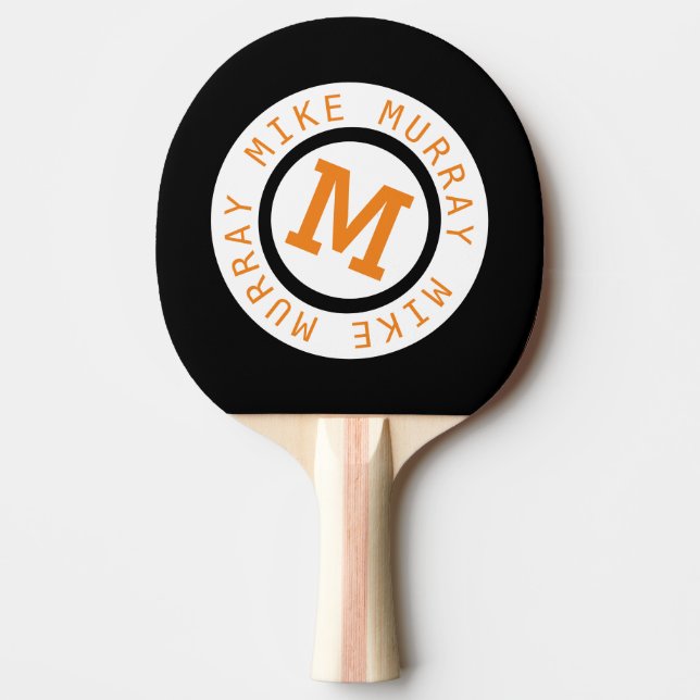monogram på svart pingisracket (Framsidan)