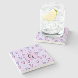 Monogram-ritning av små fantasifulla hjärtan rosa stenunderlägg