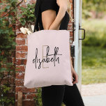 Monogram  Rosa Tygkasse<br><div class="desc">Gör en påstående med den här bedövande monogrammet svart och vit totepåse. Den här snyggten ger modern, skript som skrivs in i en elegant som kan vända huvudet var du än är. Med stort utrymme för dina essentiella saker och ett unikt stil, kommer väskan säkert att bli ett tillbehör som...</div>
