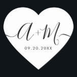 Monogram Script Custom Wedding date Heart Hjärtformat Klistermärke<br><div class="desc">Elevate your wedding details with the Minimalist Monogram Script Custom Wedding Date Heart shaped Sticker (see other shapes). This elegant and personalized sticker adds a touch of sophistication to your wedding stationery, allowing you to showcase your monogram and wedding date in a simple yet impactful way. The sticker features a...</div>