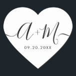 Monogram Script Custom Wedding date Heart Hjärtformat Klistermärke<br><div class="desc">Elevate your wedding details with the Minimalist Monogram Script Custom Wedding Date Heart shaped Sticker (see other shapes). This elegant and personalized sticker adds a touch of sophistication to your wedding stationery, allowing you to showcase your monogram and wedding date in a simple yet impactful way. The sticker features a...</div>
