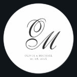 Monogram Script Minimalist Wedding Runt Klistermärke<br><div class="desc">Add a personal and elegant touch to your wedding favors, envelopes, or packaging with this minimalist round sticker featuring your custom monogram in a graceful script font. Designed to complement a modern and timeless wedding theme, this classic black-and-white design pairs beautifully with any part of your celebration. Perfect for sealing...</div>