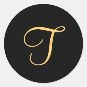 Monogram T, guld färgad initial T på svart. Runt Klistermärke