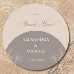 Monogram Taupe Floral Japandi Wedding Thank You Runt Klistermärke<br><div class="desc">Personalize this elegant Japandi Wedding thank you sticker featuring a beautiful fusion of Scandinavian and Japanese styles, known as Japandi. It showcases organic shapes in soft shades of taupe and calming earth tones, creating a minimalist yet warm aesthetic. The design includes the couple's monogram highlighted by stylish typography paired with...</div>