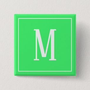 Monogram vit på ljusgrön fyrkantig knapp