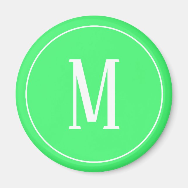 Monogram vit på ljusgrön rund magnet (Framsidan)