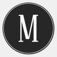 Monogram Vit på svart rund etikett