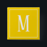 Monogram Vitt på Golden Gult Square Button Knapp<br><div class="desc">En fyrkantig knapp med ett vitt monogram på en gyllene gults bakgrund. Anpassa knappen med en egen initial eller initialer,  färg,  bland andra alternativ.</div>