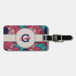 Monogramen med bollar av handarbetegarn - resa bagagebricka