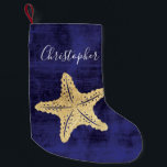 Monogrammad elegant Blue Guld Beach Sea Star Liten Julstrumpa<br><div class="desc">Elegant guld färgad Havsstjärna eller stjärnfisk med monogrammat namn. Blå bakgrund. Perfekt för strandstuvning eller nautisk jul.</div>