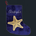 Monogrammad elegant Blue Guld Beach Sea Star Liten Julstrumpa<br><div class="desc">Elegant guld färgad Havsstjärna eller stjärnfisk med monogrammat namn. Blå bakgrund. Perfekt för strandstuvning eller nautisk jul.</div>