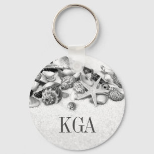 Monogrammade snäckor och stjärnfisk nyckelring