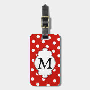 Monogrampolkaen pricker bagagemärkren bagagebricka