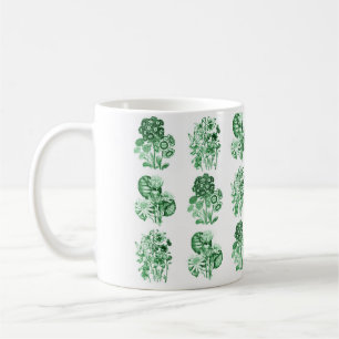 Monokroma blommor i grönt kaffemugg