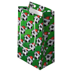Mönster för fotbollbollSanta hatt på grönt