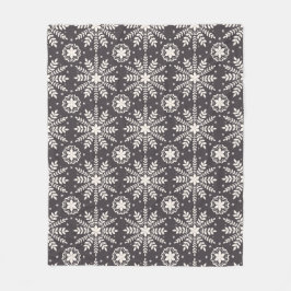 Mönster i vita snöflingor fleecefilt