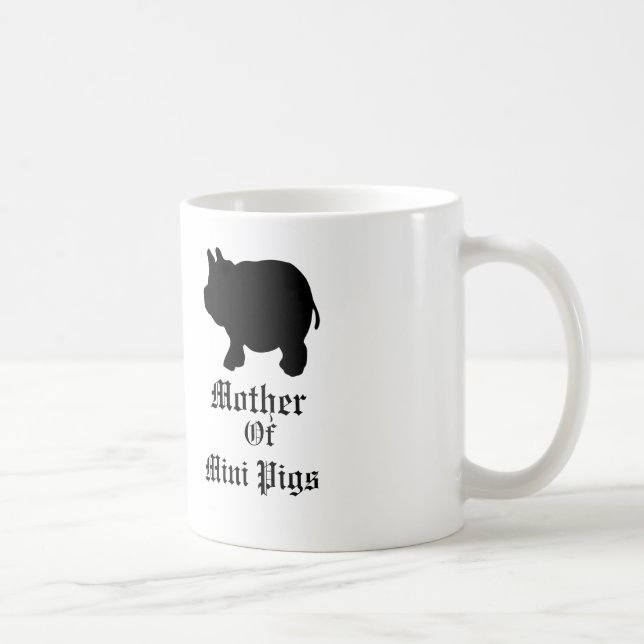 Mor av mini- grisar/med den svart mini- grisen kaffemugg (Höger)