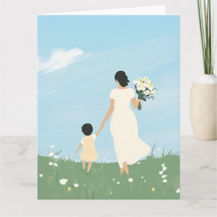 Mor och barn i en blommande äng kort