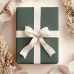 Mörk grönt presentpapper<br><div class="desc">Festiv mörk grönt förpackning papper.</div>