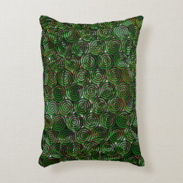 Mörk grönt spiral genomskinligt vid nedfläckad prydnadskudde