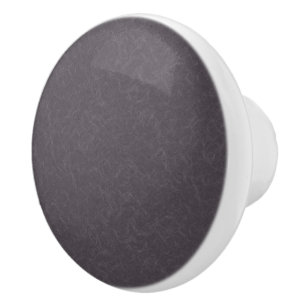 Mörk lila texturerad yta med virvlande mönster knopp