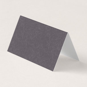Mörk lila texturerad yta med virvlande mönster visitkort